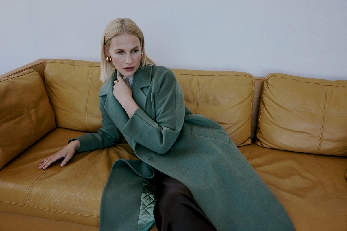 Model wearing a Kent Label sage green wool coat